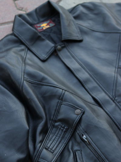 Close-up of black jacket collar and shoulder panel stitching