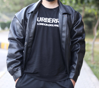 Black collared jacket worn open, showing front zip closure