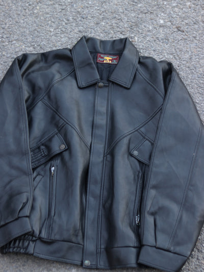 Original black panelled jacket laid flat, front view