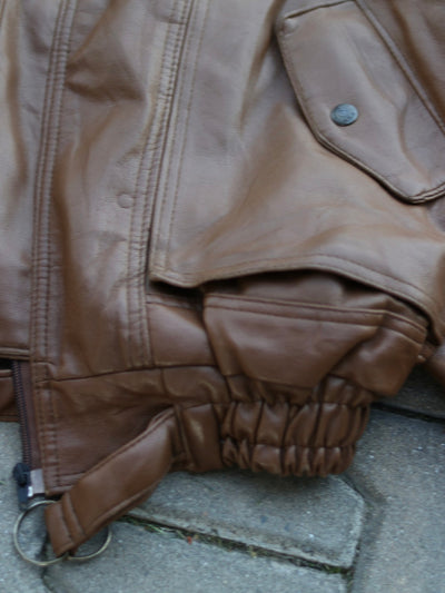 Brown jacket elasticated hem, front zip and waist strap detail